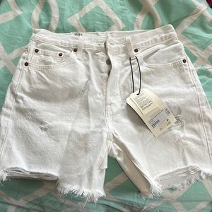 Levi’s white denim shorts.